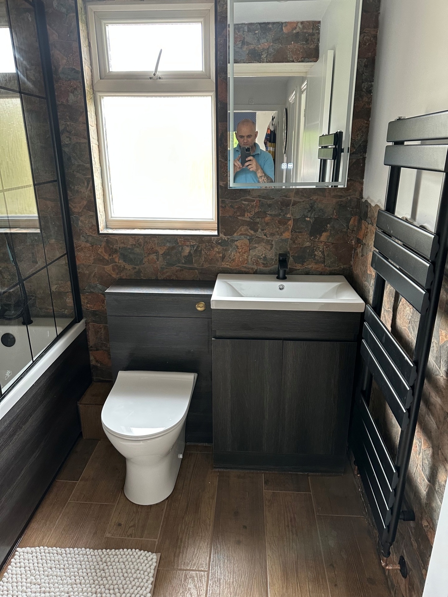 Feature stone-wall bathroom with combined vanity unit
